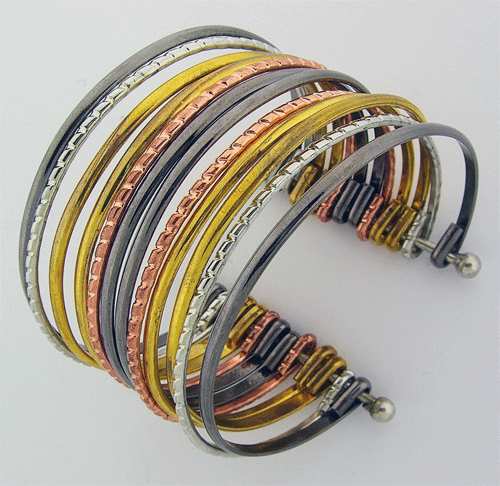 Detailed view of the 12-layer colorful metallic cuff bracelet showing copper, silver, and gold tones