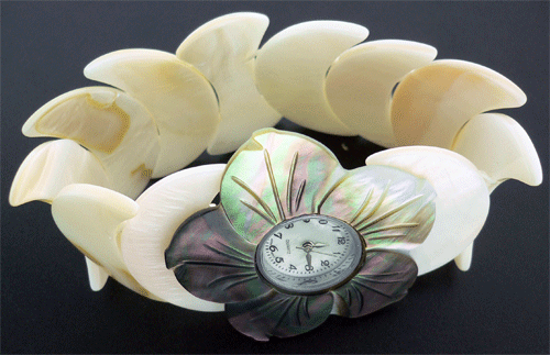 Detailed view of the White Shell Flower Watch with brown floral design