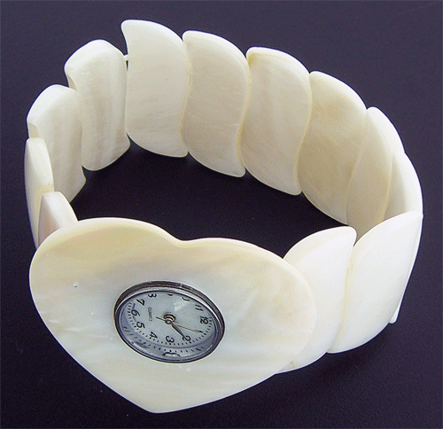 Detailed view of the exquisite White Natural Sea Shell heart shaped watch face
