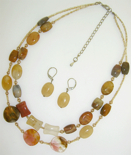 A detailed view of the natural 2-layer pink, beige and white agate necklace