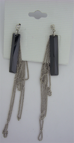 Close-up of premium silver toned earrings featuring black Swarovski crystals and clear crystal drop chains