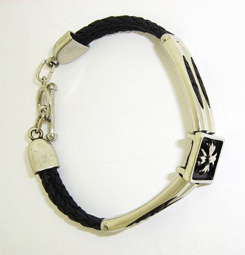 Detailed view of the premium black rubber male bracelet featuring a stylish cross on top