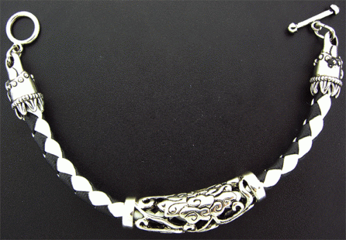 Close-up view of the Black and White rubber bracelet featuring a unique abstract design