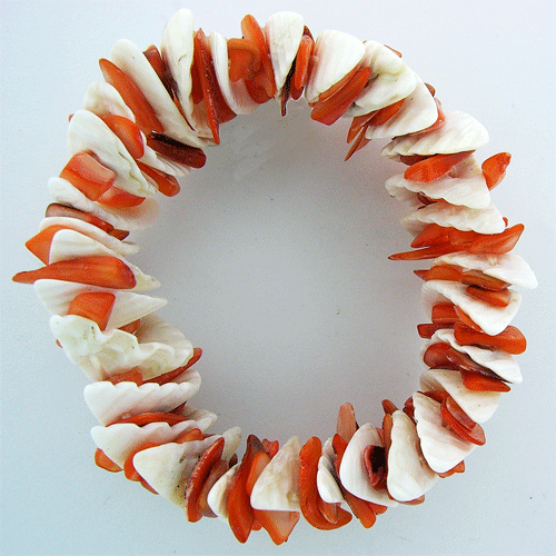 Detailed view of the handcrafted White and Carrot Shell Bracelet featuring orange and white natural seashells