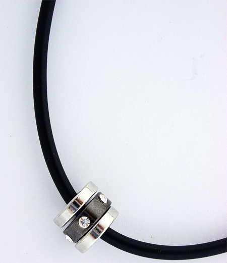 Black Rubber Necklace with intricate silver and black tone pendant featuring Swarovski crystals