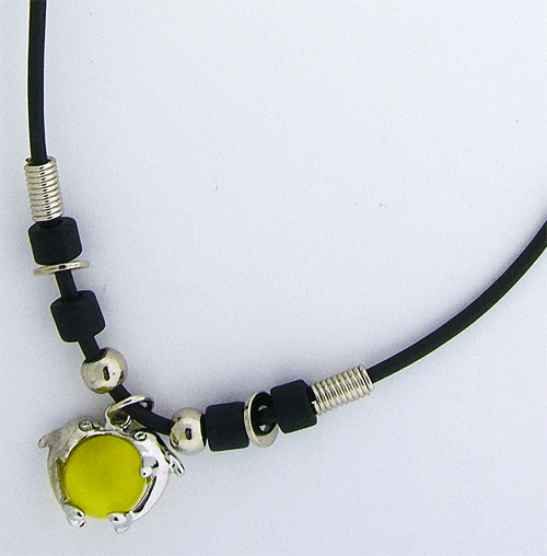 Black rubber necklace with vibrant yellow dolphin pendant