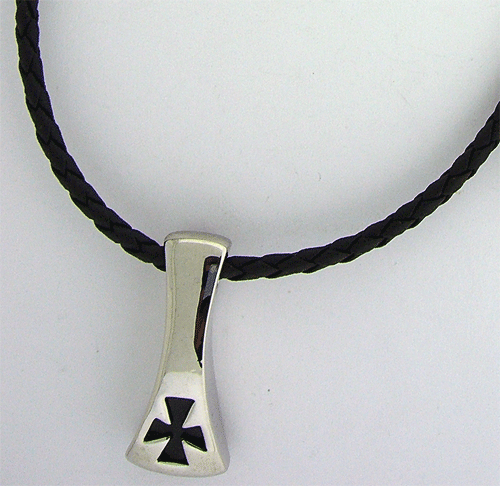 Silver toned cross pendant showing black engraved equal-armed cross attached to an adjustable black rubber necklace cord