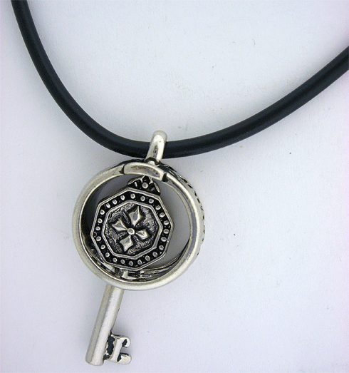 A detailed view of the Key Pendant with Rubber Necklace showcasing historical craftsmanship and modern styling