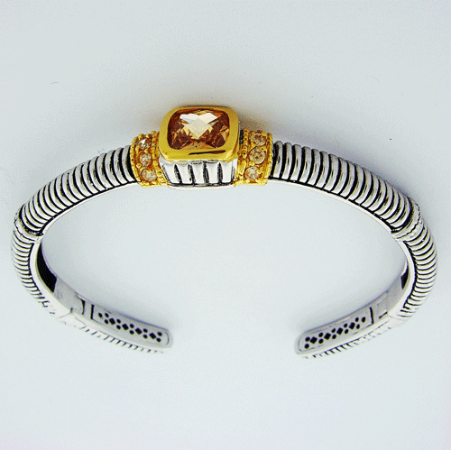 Sterling silver bangle bracelet with faceted champagne citrine and 18-karat yellow gold stations