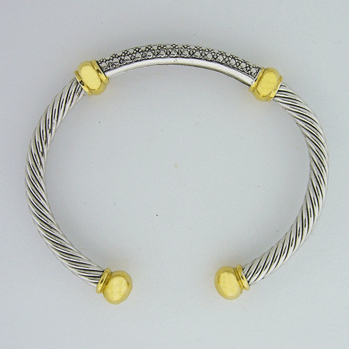 Elegant Sterling Silver Bangle Bracelet featuring 14k gold accents, inspired by classic artisan craftsmanship