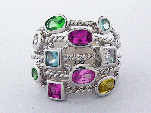 A brilliant Silver Cable Confetti Ring made of 925 sterling silver adorned with colorful topaz and peridot gemstones