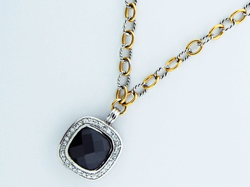 Close-up of the Sterling Silver Black Onyx Pendant on a 14K gold chain with cubic zirconia