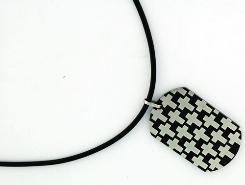 A detailed view of the Cross Rubber Necklace featuring a stainless steel pendant with silver-toned crosses and a 0.7-carat simulated diamond