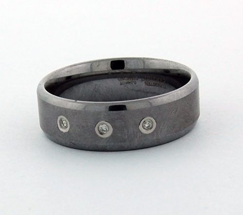 Tungsten Ring with three fine Diamonds set in the center, resting on a clean background, showcasing durability and elegance
