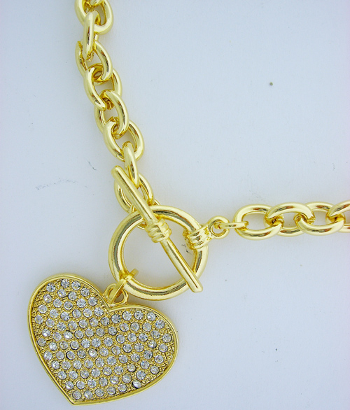 Golden Heart Pendant featuring clear Swarovski crystals and a Tiffany-inspired clasp
