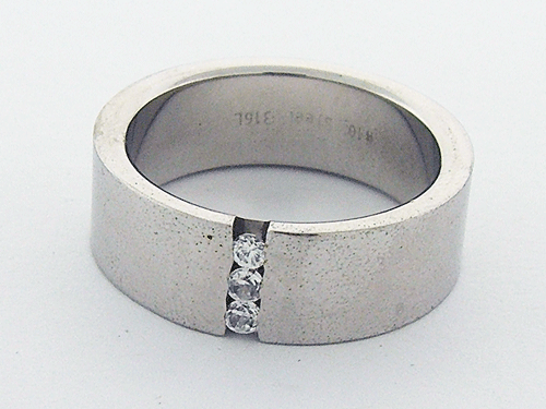 Detailed view of a premium stainless steel band featuring three cubic zirconia stones
