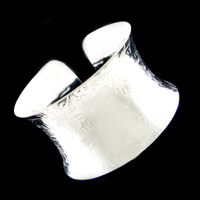 Detailed view of the Wide Cuff Elephant engraved Bangle Bracelet