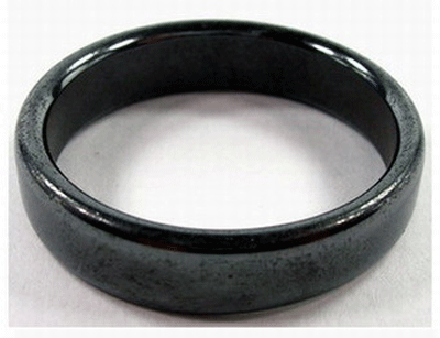 Polished magnetic hematite flat-top ring on display