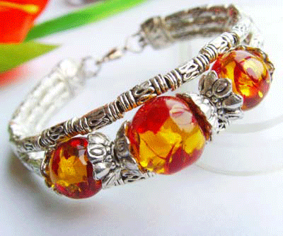 Detailed view of the Beaded Tibet Silver Bracelet featuring three yellow beads and intricate silver work