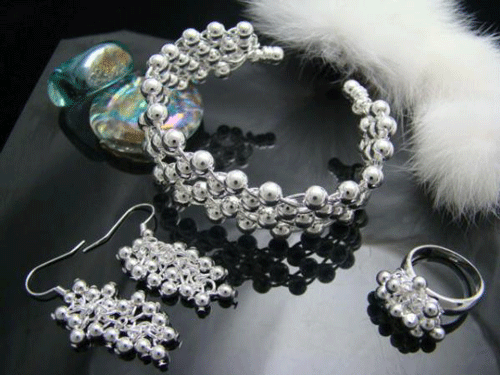 Matching 925 sterling silver bangle, ring, and drop earrings in a grape cluster design
