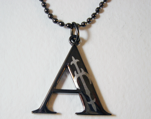A Initial Tungsten Necklace in premium black Tungsten Carbide showcasing modern abstract design