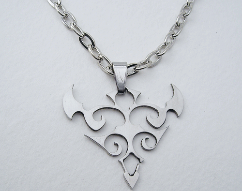 A detailed view of the Abstract Tribal Bull Stainless Steel Necklace featuring a cutout pendant