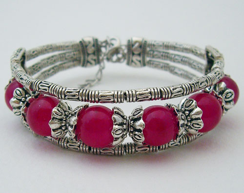 Detailed view of the Light Mulberry Tibet Silver Bracelet featuring six handcrafted silver beads