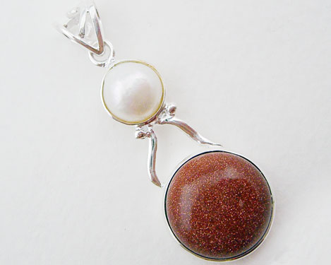 Handcrafted 925 Sterling Silver Pendant featuring a round sparkly reddish-brown GoldStone and white freshwater pearl