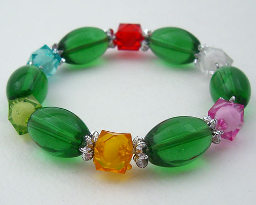 Colorful stretch bracelet with green oval and multi-color square beads